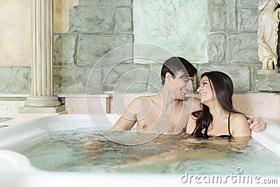 Couple relaxing in the hot tub