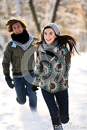 Couple running in the snow