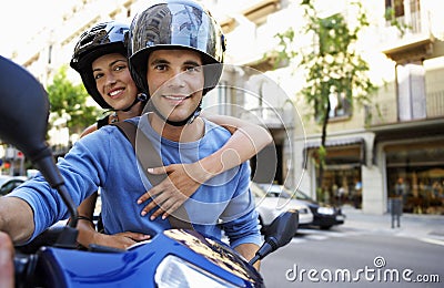 Couple On Scooter Enjoying Road Trip