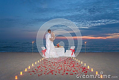 Couple share a romantic dinner with candles