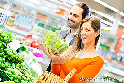 Couple shopping groceries in supermarket