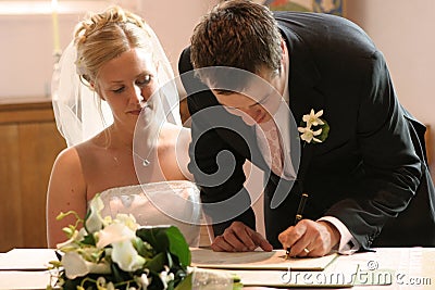 Couple Signing Wedding Marriage Register