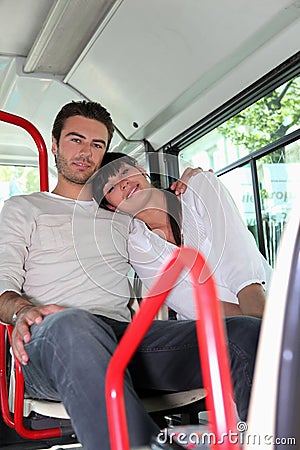 Couple sitting on a bus