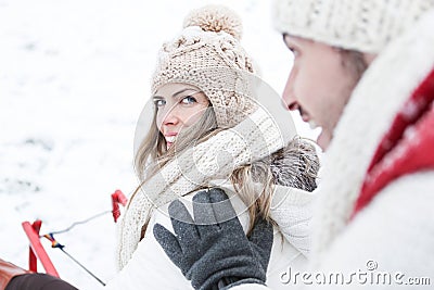 Couple sledding together in winter