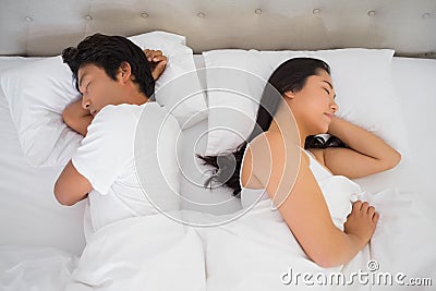 Couple sleeping in bed