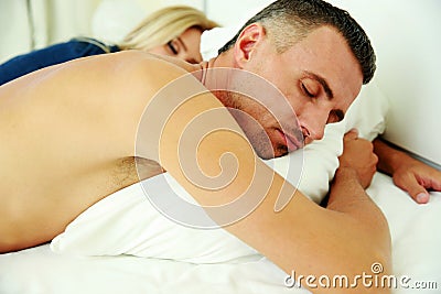 Couple sleeping in the bed