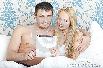 Couple with tablet computer