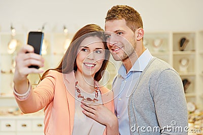 Couple taking photo with smartphone