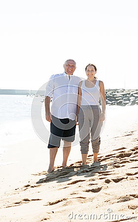 Couple walking along the sea