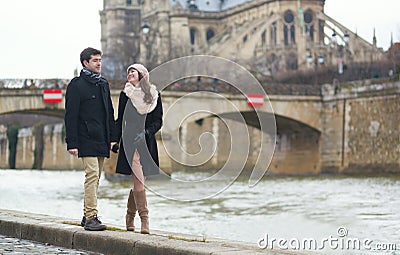 Couple walking near the Notre-Dame in Paris
