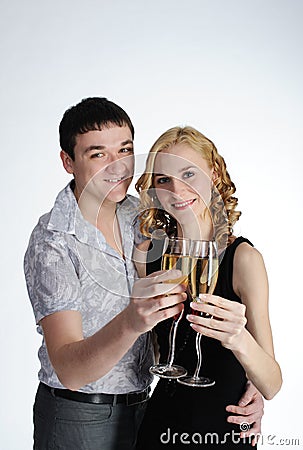 Couple of young girl and man drink champagne