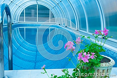 Covered summer pool with a blue tile