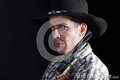 Cowboy with hat and revolver