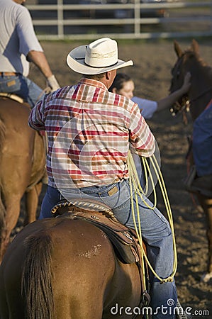 Cowboy on horse with rope