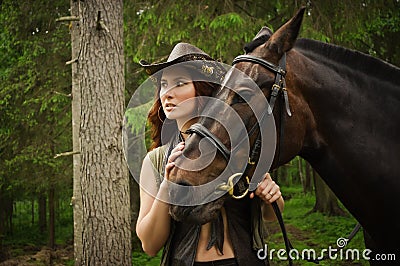 Cowgirl with brown horse