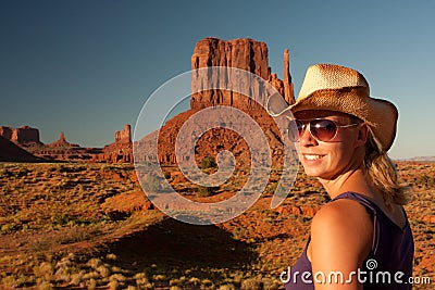 Cowgirl posing in monument valley