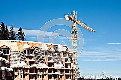Crane construction machinery at snow