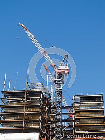 Cranes on top of new tower construction