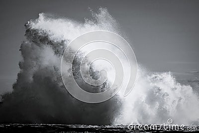 Crashing waves on rock ledge