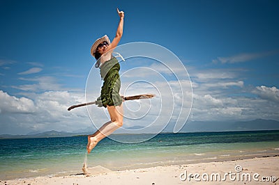 Creative girl happy jump at tropical beach
