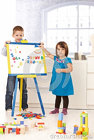 Creative small kids with drawing board