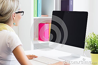 Creative woman working with computer in the office