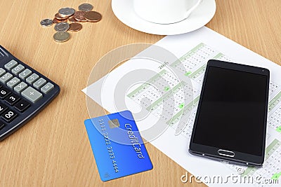 Credit Card On A Desk With A Calculator And Calendar Stock