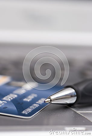 Credit card, pen and computer