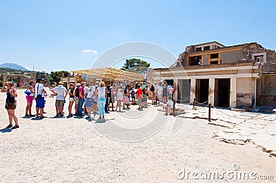 CRETE,GREECE-JULY 21: Tourists at the Knossos palace on July 21,2014 on the Crete island in Greece. Knossos is the largest Bronze