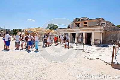 CRETE,GREECE-JULY 21: Tourists at the Knossos palace on July 21,2014 on the Crete island in Greece. Knossos palace is the largest