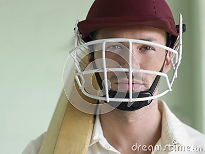 Cricket player In Helmet And With Bat