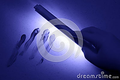 Crime Scene under UV Black Light Wand in Tech Hand