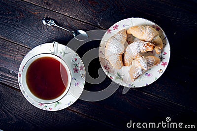 Croissant with jam and tea for breakfast