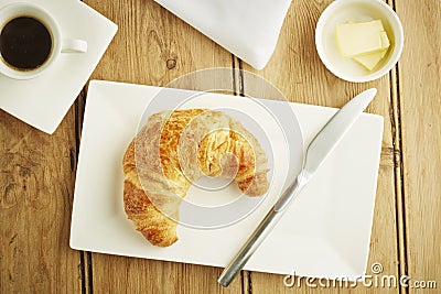 Croissant pastry on white dish