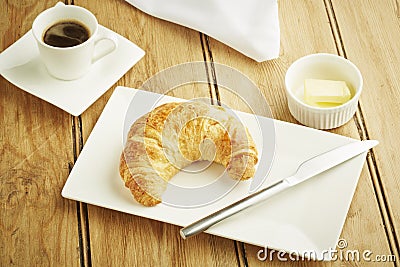 Croissant pastry on white dish