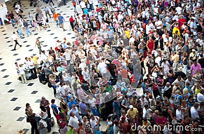 Crowd of people in the airport queue