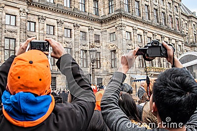 Crowd taking pictures at Koninginnedag 2013