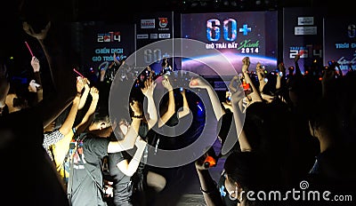 Crowded atmosphere, raise hand in earth hour