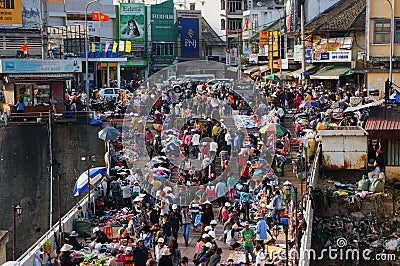 Crowded scene at market with crowd of people