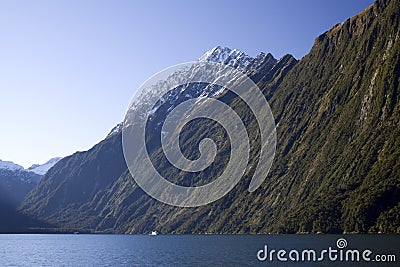 Royalty Free Stock Photo: Cruise boat against the milford sound 