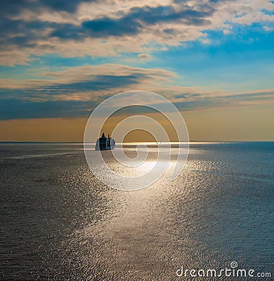 Cruise liner in the sea at sunset