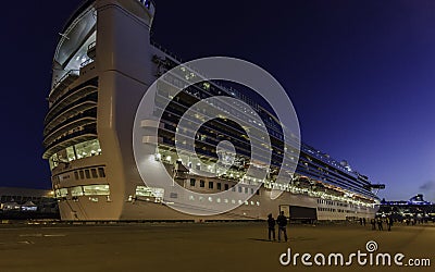 Cruise Ship And People At Dusk