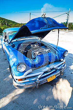 Cuba classic american car with open hood front view