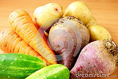 Cucumber, carrots, beets, potatoes on the table