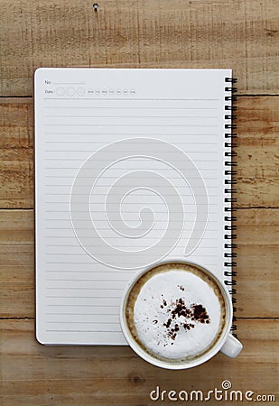 Cup of coffee and notebook