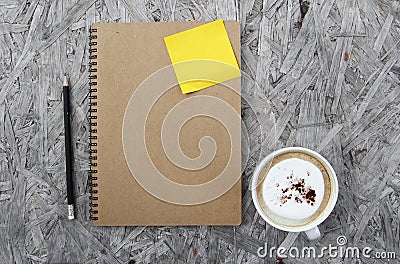 Cup of coffee and notebook