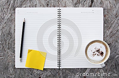 Cup of coffee and notebook