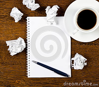 Cup of coffee, paper and pen