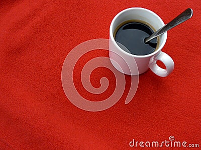 Cup of coffee on red
