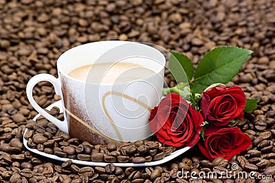 Cup of coffee and red roses